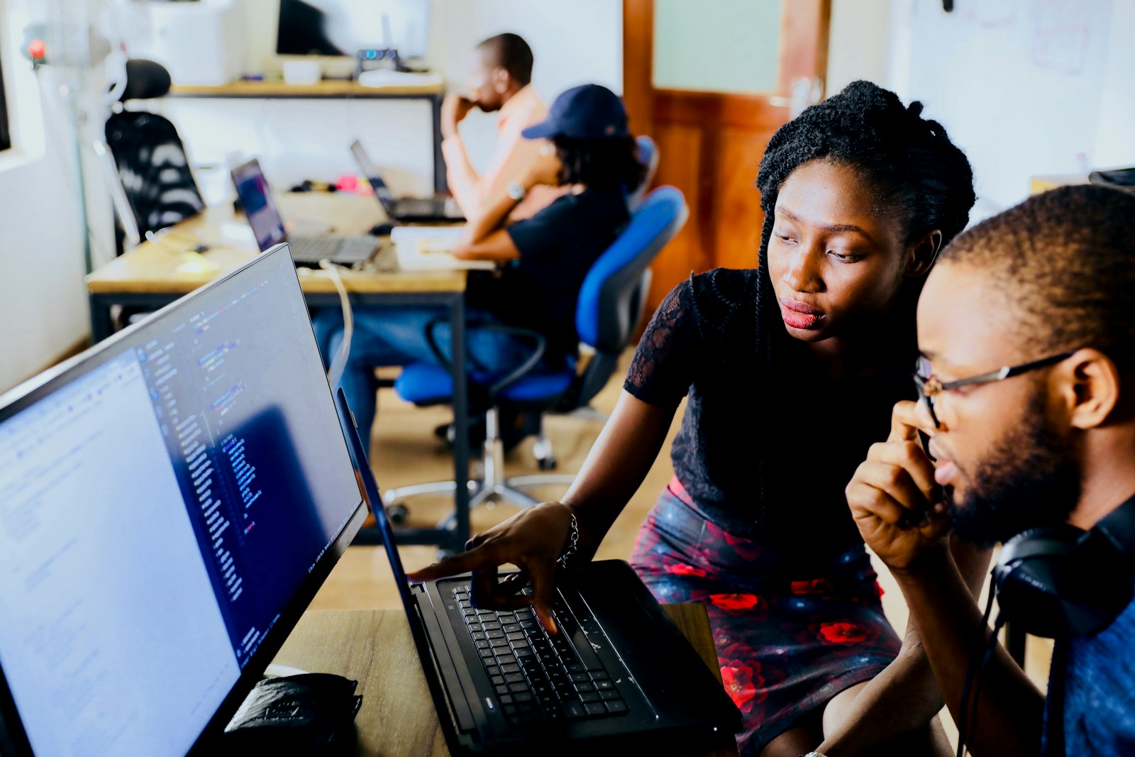 Two developers reviewing code together